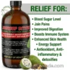 A marketing photograph featuring a single, large amber glass bottle of liquid "SOURSOP BITTERS" with a black cap. The front label on the bottle is detailed, featuring red and white text on a black background, clearly visible with "21 DIFFERENT HERBS AND ROOTS HELP TO SUPPORT NATURAL WELLNESS" prominently listed above a long list of specific ingredients, including Black Seed, Honey, Garlic, Cinnamon, and Maca. Below the bottle are illustrations of a halved soursop fruit revealing its white flesh and seeds, alongside a group of various dried herbs and seeds. The upper left corner features "THE ORGANIC MADE, NATURAL & HEALTHY" logo. To the right of the bottle, on a split light gray and light green background, large green text reads "RELIEF FOR:" followed by a vertical bulleted list in green text: "Blood Sugar Level", "Join Pains", "Improved Digestion", "Boosts Immune System", "Enhanced Skin Health", "Energy Support", "Antioxidant, Anti-inflammatory & detoxifies". The website address "www.theorganicmade.com" is shown in white text across the bottom. The entire composition is set against a clean white background, presenting a balanced and informative layout.