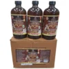 A photograph of three 16oz amber glass bottles of "Botanical Fibroid & Lupus" Eliminate Care Tonic stacked on a brown cardboard shipping box against a white background. The full labels of the bottles are visible, featuring the Essential Palace logo and a comprehensive list of ingredients like Magnesium, Lion's Mane, French Tarragon, and Linseed. The complex case label on the box detailed health benefits and ingredients.