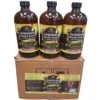A product shot of three brown glass bottles with black caps and the label "Jamaican Wood & Neem LIVING BITTER Miraculous Detox Bitter 5 IN 1 JAMAICAN TONIC," sitting on top of an unbranded brown corrugated cardboard box. The box has a large label below the bottles with detailed ingredients, instructions, and an illustration of the digestive system. The background is a clean white.