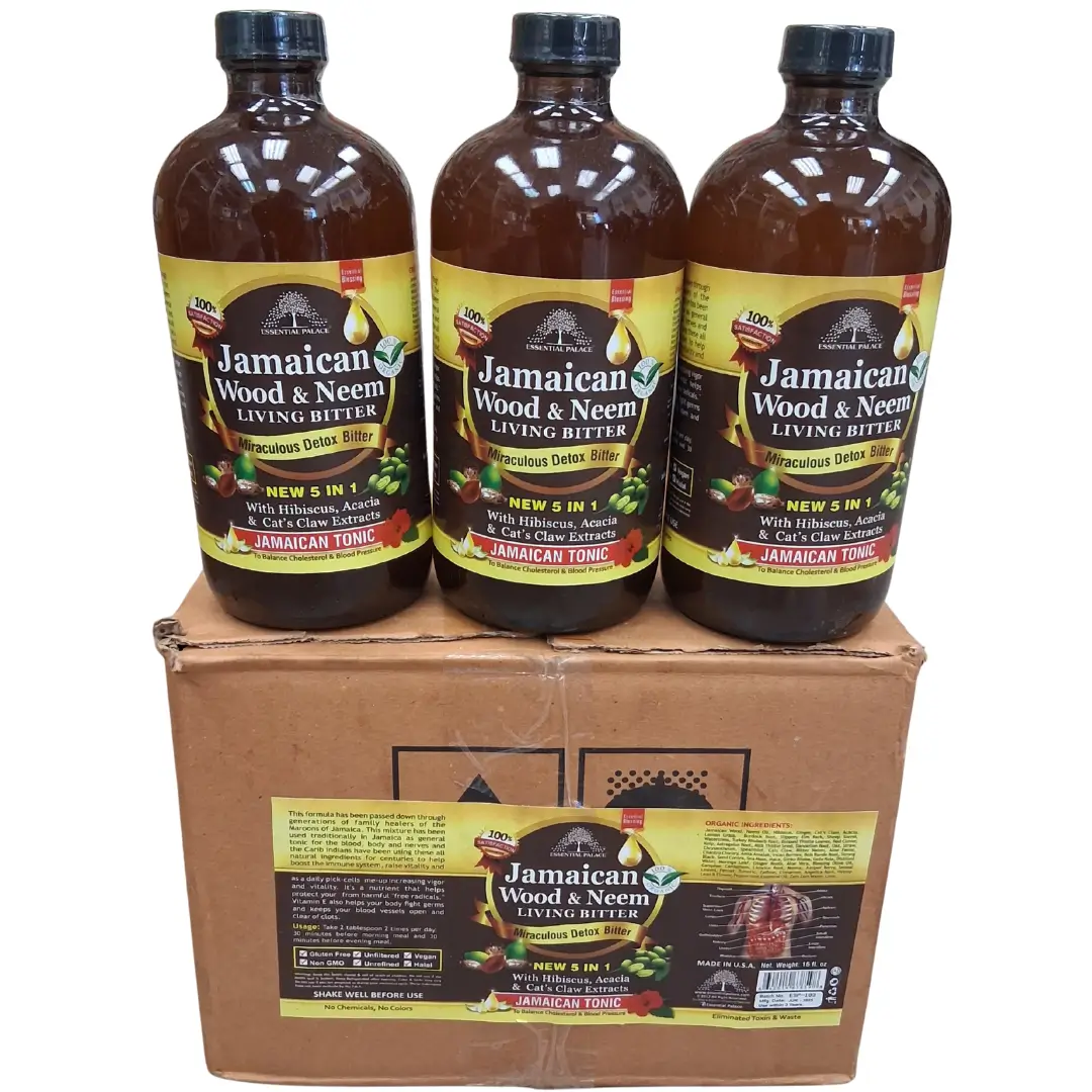 Jamaican Wood & Neem Living Bitter 16oz - Wholesale 1 A product shot of three brown glass bottles with black caps and the label "Jamaican Wood & Neem LIVING BITTER Miraculous Detox Bitter 5 IN 1 JAMAICAN TONIC," sitting on top of an unbranded brown corrugated cardboard box. The box has a large label below the bottles with detailed ingredients, instructions, and an illustration of the digestive system. The background is a clean white.