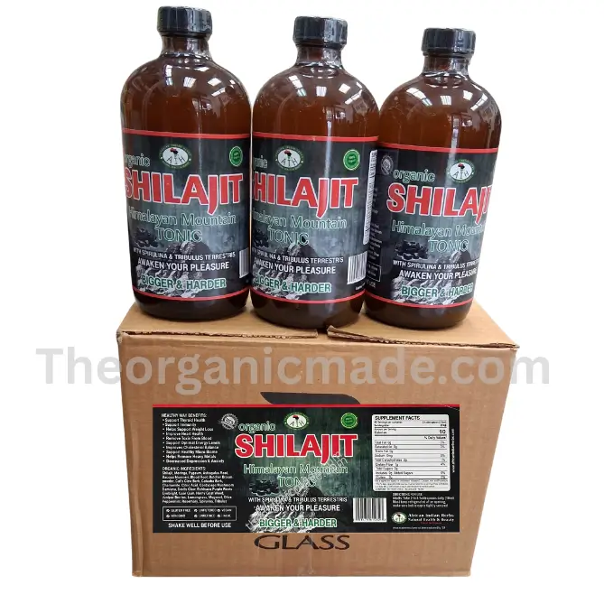 Organic Shilajit Himalayan Mountain Tonic - Wholesale 1 a row of three glass bottles of "Organic SHILAJIT Himalayan Mountain TONIC" on top of their original, branded cardboard display box, set against a white background. The labels clearly show the brand and full ingredient list