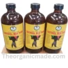 A professional marketing graphic showcasing the health benefits and ingredients of 'Natural Men Tonic EXTRA STRONG'. The image features a bottle of the dark tonic with a detailed label on the left. To the right, a list of green bullet points highlights key benefits like increased libido, energy, and improved mental well-being. At the bottom, raw natural ingredients including ginseng and maca illustrate the tonic's composition, with a watermark 'www.theorganicmade.com'. The overall design is clean and professionally presented. pack of 3