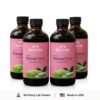 showcasing four dark glass bottles of "Serene Herbs Exotic Soursop Bitters (Mixed Berries Flavor)"